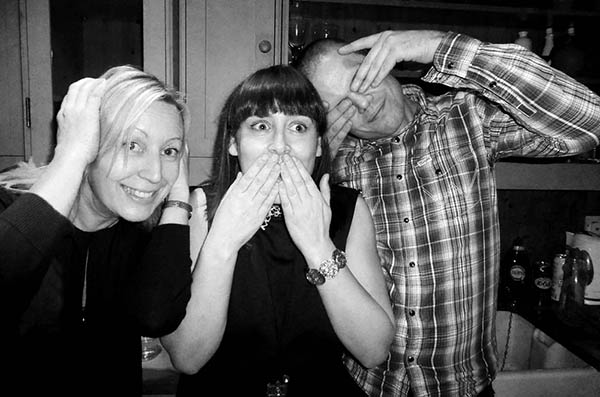 Three people doing 3 wise monkeys