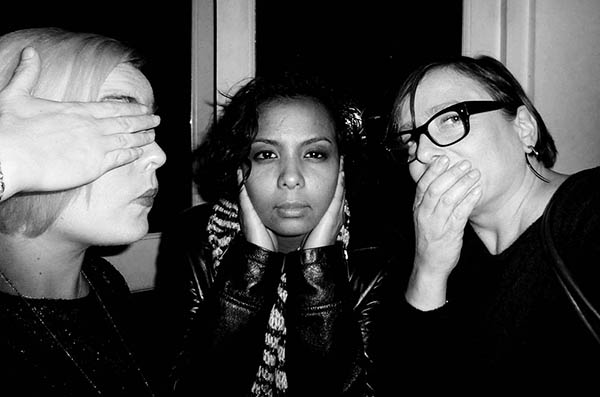 Three people doing 3 wise monkeys