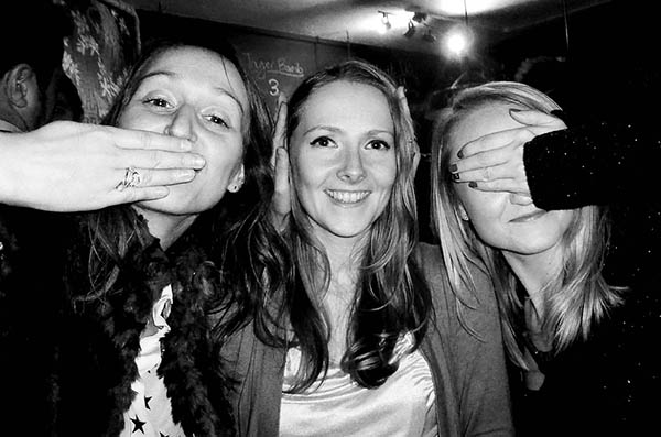 Three people doing 3 wise monkeys