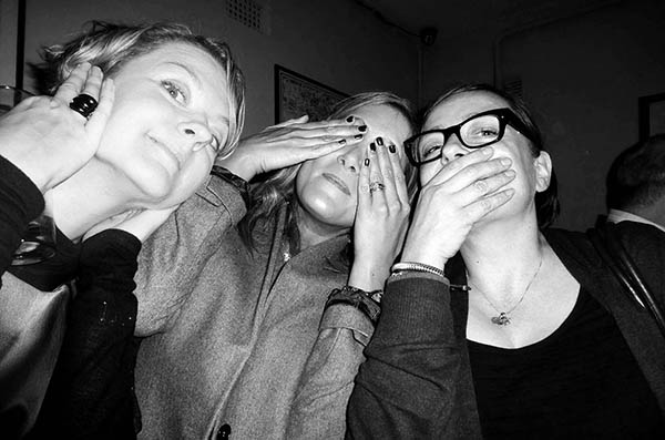 Three people doing 3 wise monkeys