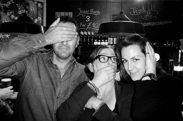 Three people doing 3 wise monkeys