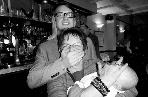 Three people doing 3 wise monkeys