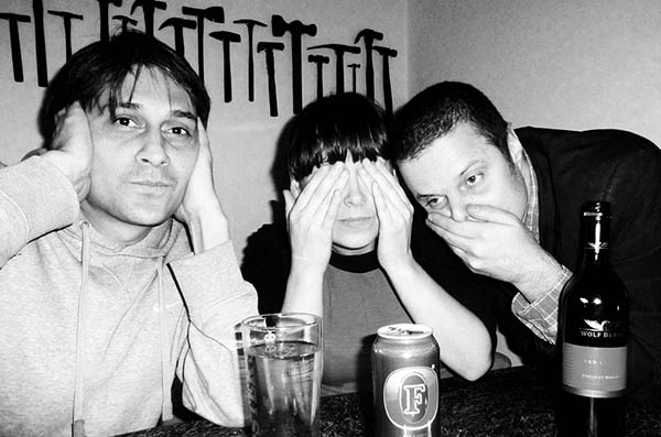 Three people doing 3 wise monkeys