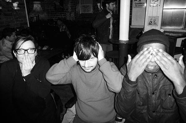 Three people doing 3 wise monkeys