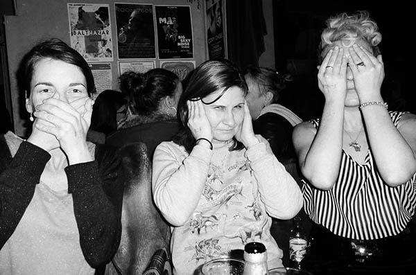 Three people doing 3 wise monkeys