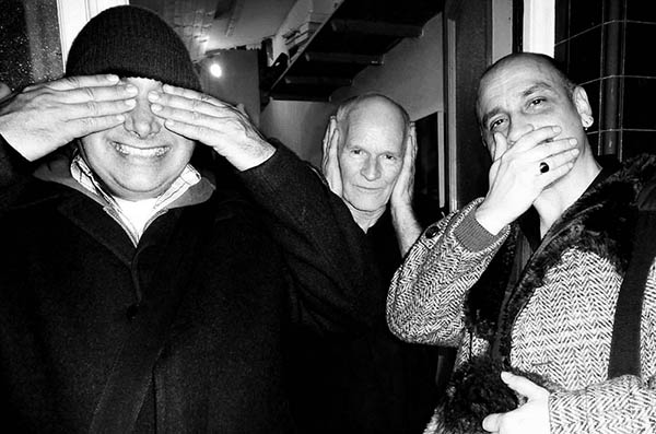 Three people doing 3 wise monkeys