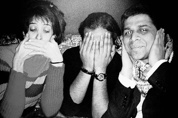 Three people doing 3 wise monkeys