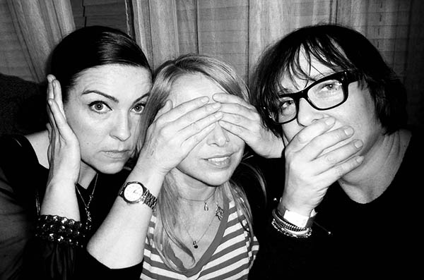 Three people doing 3 wise monkeys