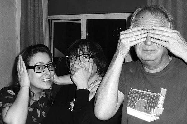 Three people doing 3 wise monkeys