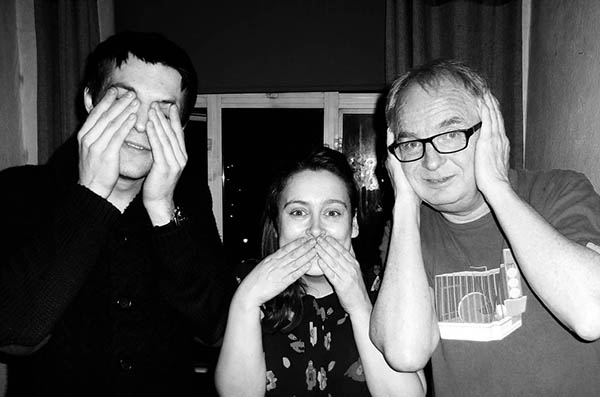 Three people doing 3 wise monkeys
