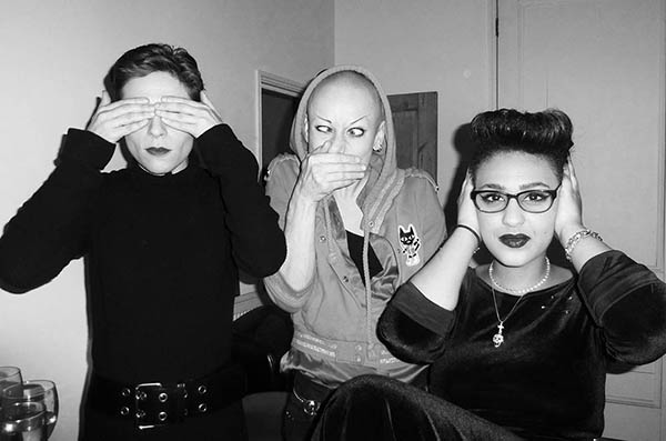 Three women doing 3 Wise Monkeys