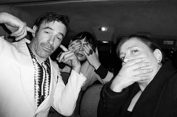 Three people in a van doing 3 Wise Monkeys