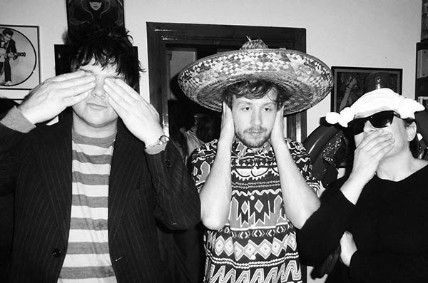 Three people in fancy dress doing 3 Wise Monkeys