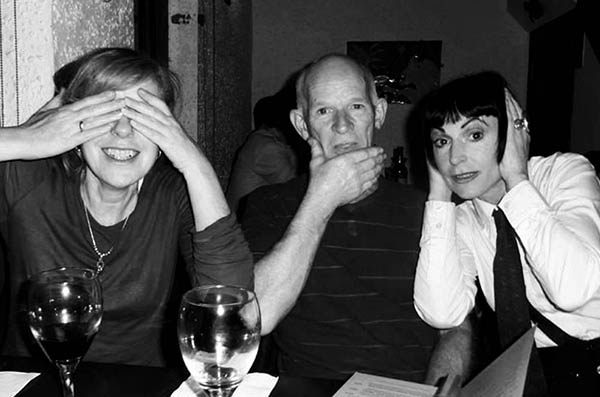 Three people doing 3 Wise Monkeys