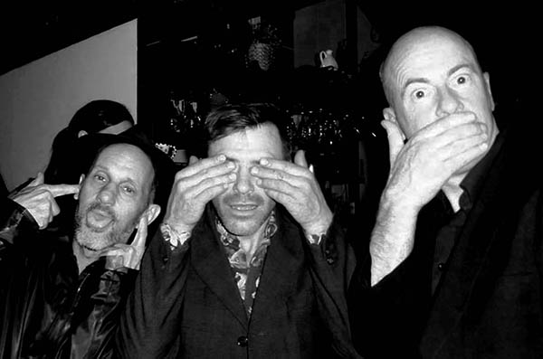 Three people doing 3 Wise Monkeys