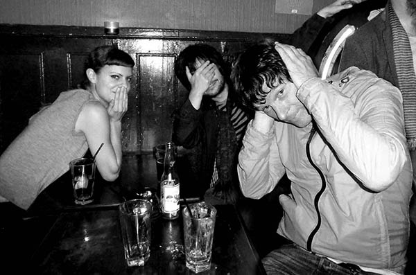 Three people doing 3 wise monkeys