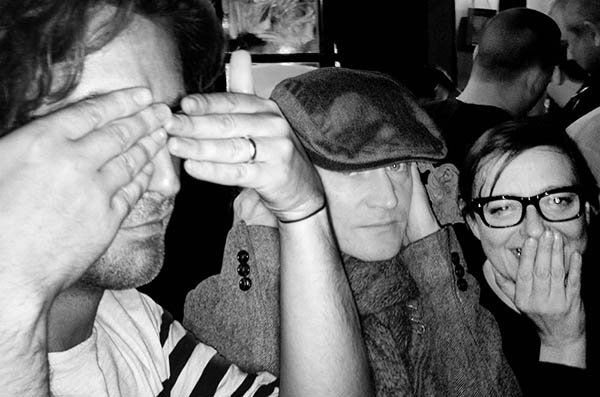 Three people doing 3 wise monkeys