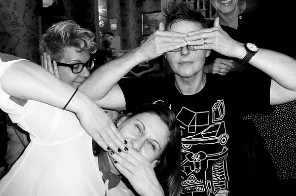 Three people doing 3 wise monkeys