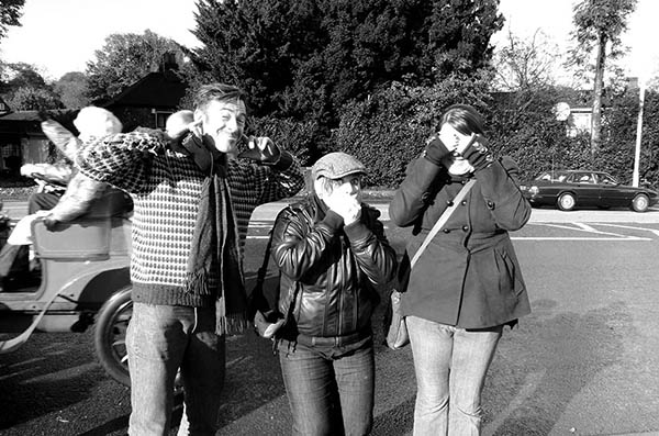 Three people doing 3 wise monkeys