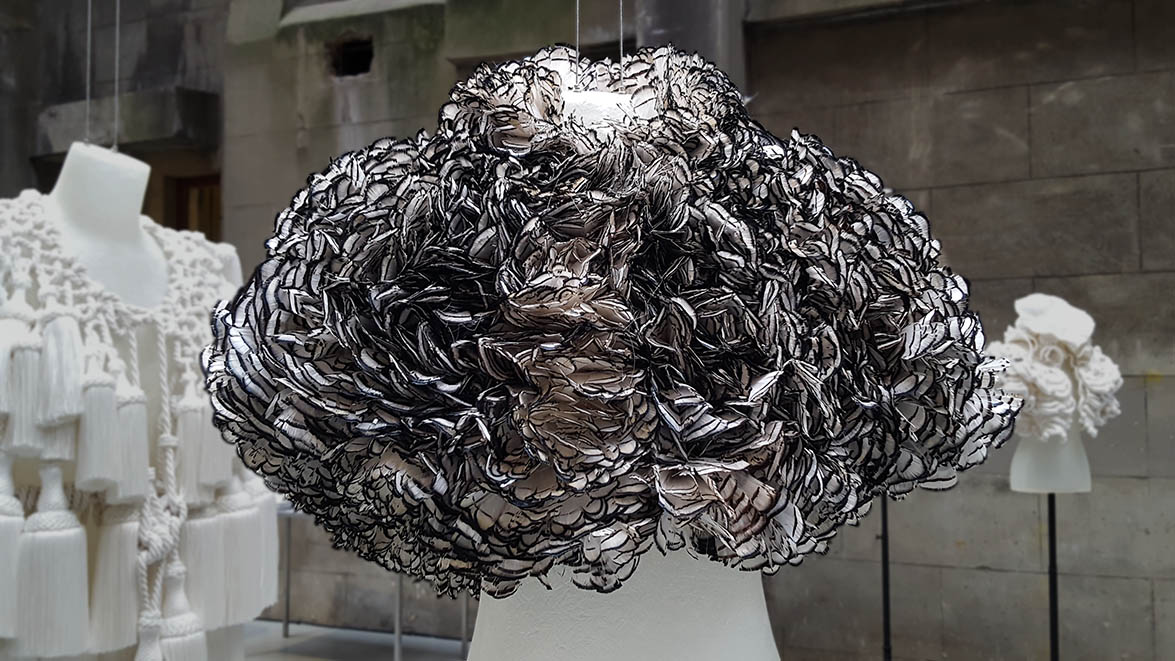 Burberry cape made from short white black tipped feathers