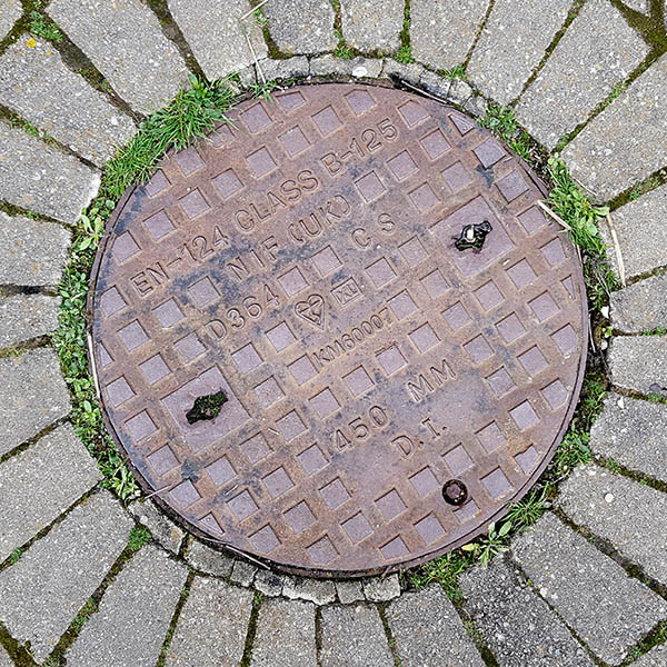 Manhole Cover, Essex - Cast iron with raised square pattern, inscribed with EN 124 CLASS B-125 NIF (UK) D364 CS KM 600007 450 MM D.I.