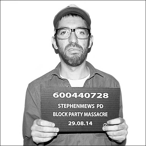 People posing for a fake police mugshot