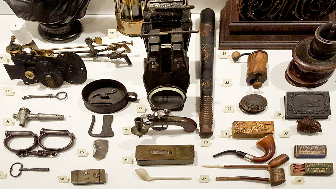 Assortment of objects displayed in glass cabinets in The Science Museum