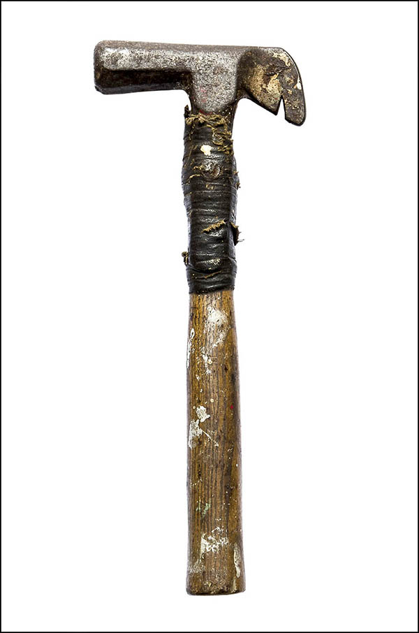 Old hammer - metal head and wooden handle held together with tape - Antique