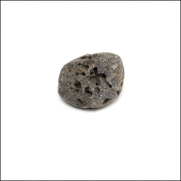 Pebble - oval, warm grey, pitted eroded