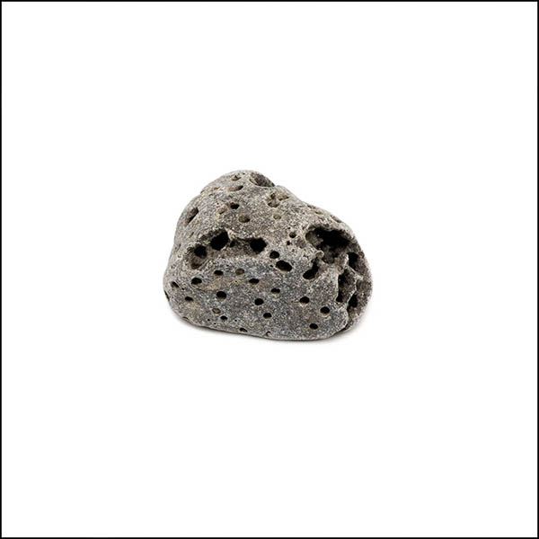 Pebble - uneven shape, warm grey, pitted eroded