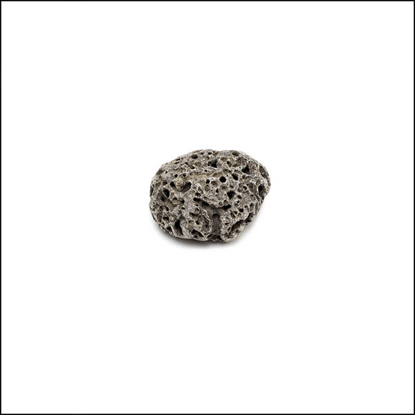 Pebble - round, warm grey, pitted eroded