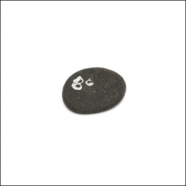 Pebble - oval, dark grey, three small white circles