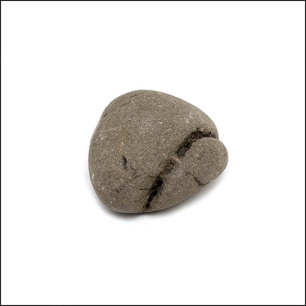 Pebble - uneven round, warm grey, one eroded diagonal line