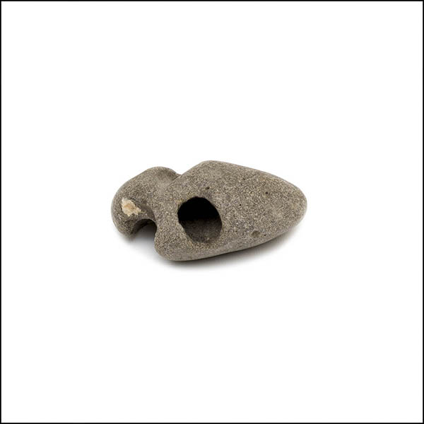 Pebble - uneven oval, warm grey, three eroded holes