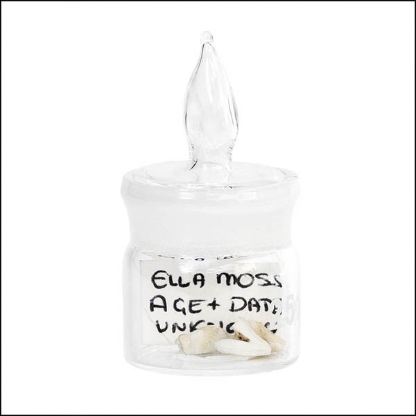 Baby Teeth in glass pot - part of tooth collection